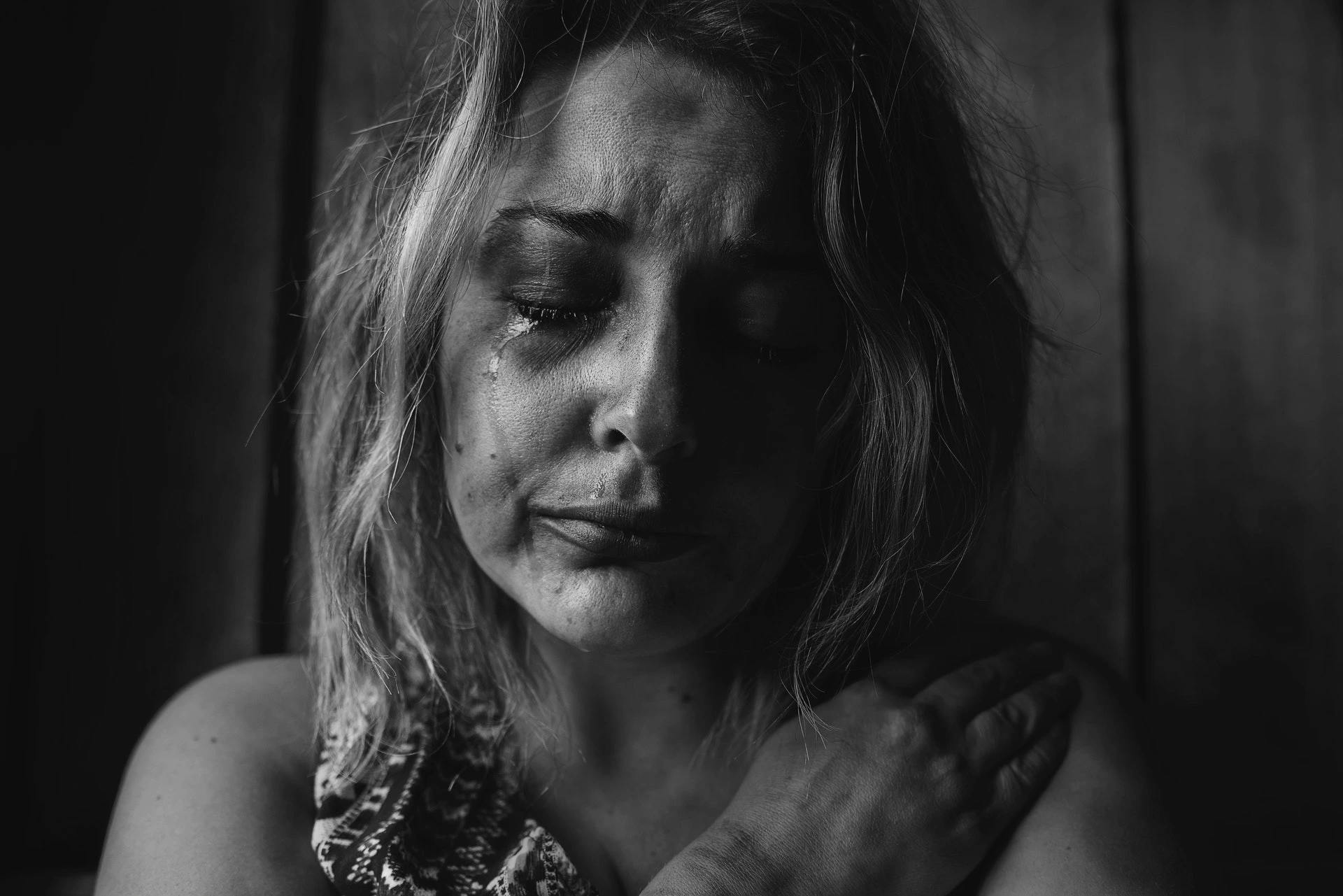 Black and white image of woman crying